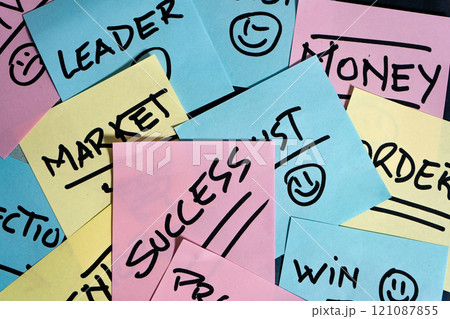 Different business-related concepts each written on a different post-it or note on top of each other. Different business-related concepts each written on a different post-it or note on top of each other. 121087855