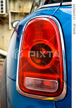 Detail of car headlights lamp, blue modern car tail red lamp 121088205