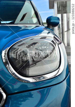 Detail of blue car headlights lamp, modern car front lamp 121088212
