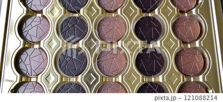 Tasty round chocolates with milk and bitter, in stylish decorative box 121088214