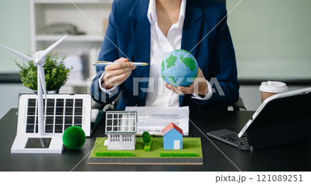 Business planning hand using laptop for working technology and business Net zero and carbon neutral concept.NET ZERO icons and symbols save the eco world 121089251