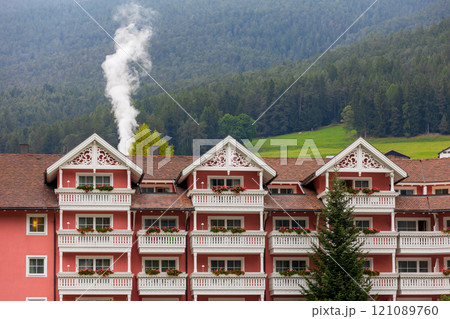 Ortisei, Italy houses and mountains in summer 121089760