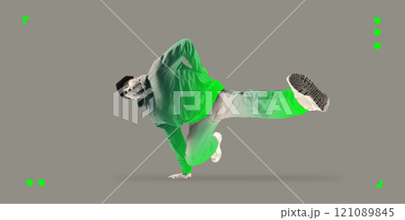 Contemporary art collage. Breakdancer in athletic pose with neon green highlights on hoodie and pants, highlighting urban culture and agility. Contemporary art collage. Breakdancer in athletic pose with neon green highlights on hoodie and pants, highlighting urban culture and agility. 121089845