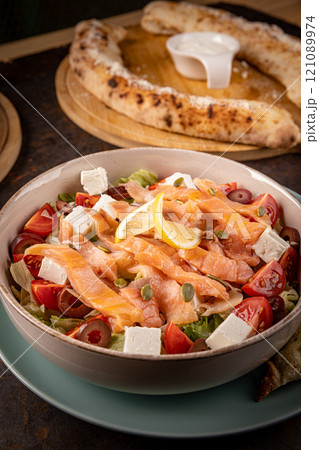 Fresh salmon salad with feta cheese 121089974