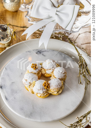 Cream puffs with praline cream filling 121089996