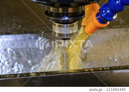 Close up scene the CNC milling machine cutting the mold parts with oil coolant method. Close up scene the CNC milling machine cutting the mold parts with oil coolant method. 121092495
