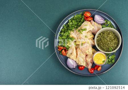 Fresh herb marinated chicken meat. Fresh herb marinated chicken meat. 121092514