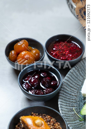 Variety of jams served on breakfast table setting 121092573