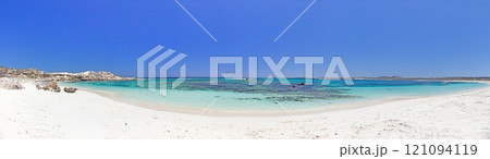 Idyllic beach with turquoise waters and rocky shoreline on Rottnest Island under a bright blue sky 121094119