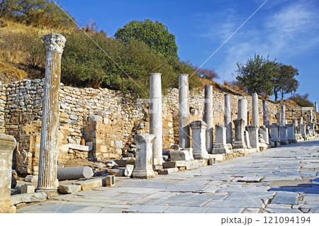 Historical Turkey pillars Ephesus in an ancient city. Excavated remains of historical building stone in Turkish history and culture. Ruin of ancient roman architecture in a popular tourism attraction Historical Turkey pillars Ephesus in an ancient city. Excavated remains of historical building stone in Turkish history and culture. Ruin of ancient roman architecture in a popular tourism attraction 121094194