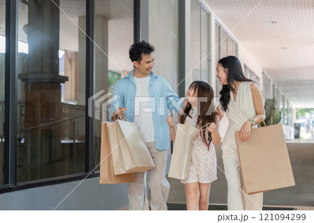 Family shopping day adventure at the mall candid moments urban environment joyful atmosphere family bonding concept Family shopping day adventure at the mall candid moments urban environment joyful atmosphere family bonding concept 121094299