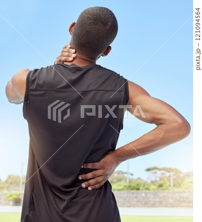 Injured athlete with sore neck and back muscles from behind. Uncomfortable athlete suffering from pain from tight and inflamed joints. Body strain and discomfort caused by overexertion from exercise Injured athlete with sore neck and back muscles from behind. Uncomfortable athlete suffering from pain from tight and inflamed joints. Body strain and discomfort caused by overexertion from exercise 121094564