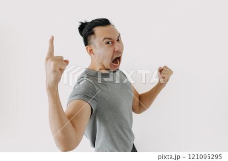 Angry and furious shouting face of man in grey t-shirt isolate on white. Angry and furious shouting face of man in grey t-shirt isolate on white. 121095295