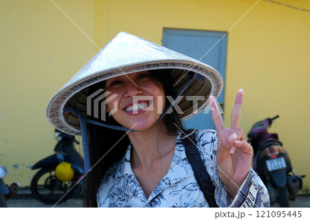 Portrait of Vietnamese girl traditional red dress,Beautiful young asian woman wearing Vietnam 121095445