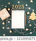 Green with white blank notepad numbers 2025. Concept of planning and setting goals for future. Atmosphere of New Years holiday 121095873