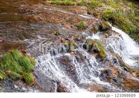 Ginzan onsen, Yamagata, Japan, Flowing water over rocks and mossy terrain. Ginzan onsen, Yamagata, Japan, Flowing water over rocks and mossy terrain. 121098689