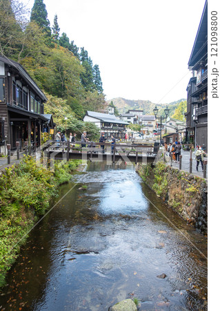 Ginzan onsen, Yamagata, Japan ,Scenic view of a river surrounded by traditional buildings. 121098800