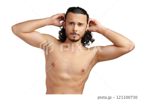 Young man with curly hair thoughtfully posing against a plain background Young man with curly hair thoughtfully posing against a plain background 121100730