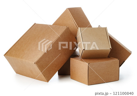 Stacked brown cardboard boxes in various sizes arranged on a white background 121100840