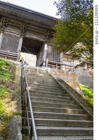 Risshaku-ji Temple at Yamadera, Yamagata, Japan. Stone stairs leading to a traditional building entrance. Risshaku-ji Temple at Yamadera, Yamagata, Japan. Stone stairs leading to a traditional building entrance. 121100989