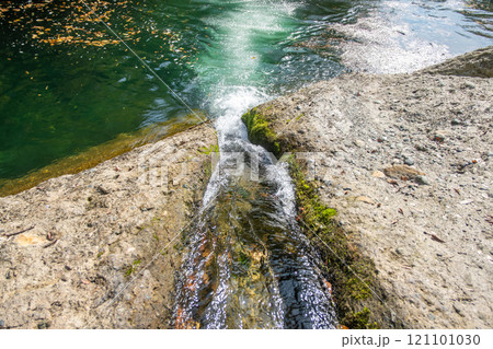 Yamadera, Yamagata, Japan. Flowing water over a rocky surface Yamadera, Yamagata, Japan. Flowing water over a rocky surface 121101030