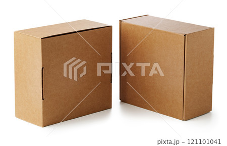 Two brown cardboard boxes stacked together on a plain surface 121101041