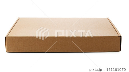 A plain cardboard box resting on a flat surface ready for shipping 121101070