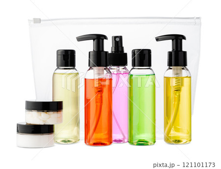 Variety of colorful personal care bottles and grooming accessories arranged on a white surface Variety of colorful personal care bottles and grooming accessories arranged on a white surface 121101173