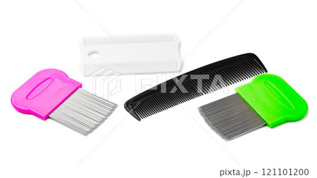 Colorful plastic and metal combs on a white background Colorful plastic and metal combs on a white background 121101200
