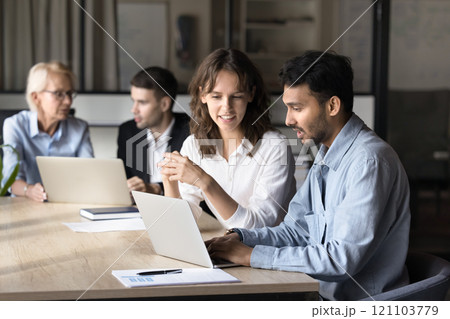 Two businesspeople discussing new project using laptop Two businesspeople discussing new project using laptop 121103779