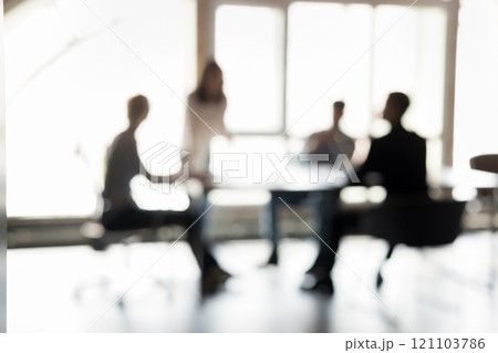 Blurred silhouettes of entrepreneurs participate in business meeting Blurred silhouettes of entrepreneurs participate in business meeting 121103786