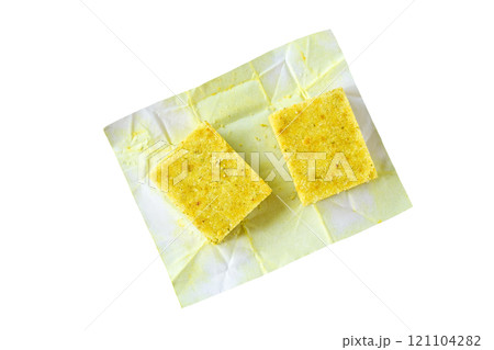 Unwrapped bouillon cube isolated on a white background. Unwrapped bouillon cube isolated on a white background. 121104282