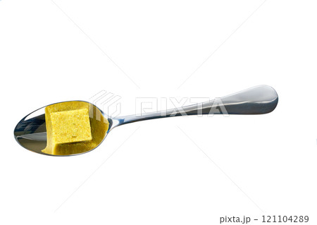 chicken bouillon cube in a metall spoon isolated on a white background. Top view. chicken bouillon cube in a metall spoon isolated on a white background. Top view. 121104289