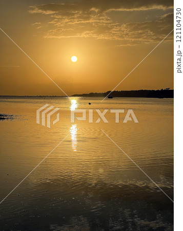 Beautiful sunset on ocean beach. Sky is reflecting at water. Philippines, Bohol 121104730