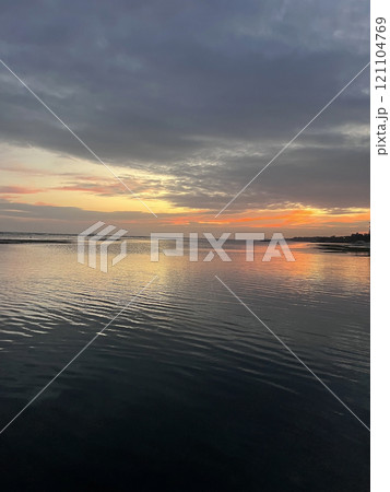 Beautiful sunset on ocean beach. Sky is reflecting at water. Philippines, Bohol 121104769