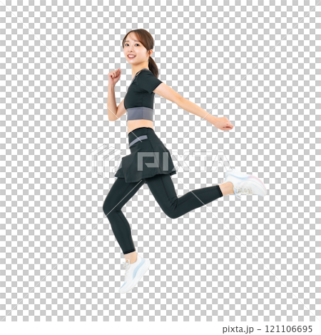 A woman jumping in sportswear. A transparent full-body photo PNG precisely cut by hand. A woman jumping in sportswear. A transparent full-body photo PNG precisely cut by hand. 121106695