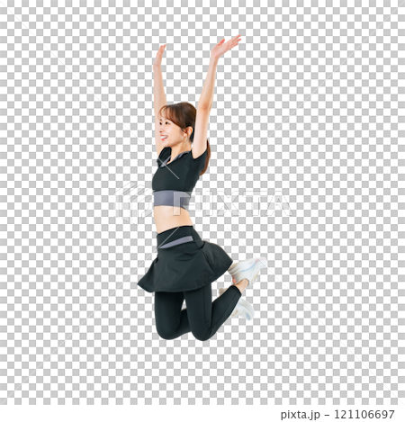 A woman jumping in sportswear. A transparent full-body photo PNG precisely cut by hand. 121106697