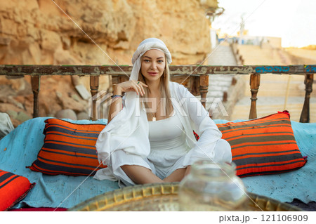 Portrait of a beautiful woman in Arabic clothing in Egypt during sunset. Portrait of a beautiful woman in Arabic clothing in Egypt during sunset. 121106909