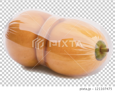 Sapodilla (Manilkara zapota) A smooth, round sapodilla wrapped in clear plastic. The fruit's brown, slightly rough skin is visible through 121107475