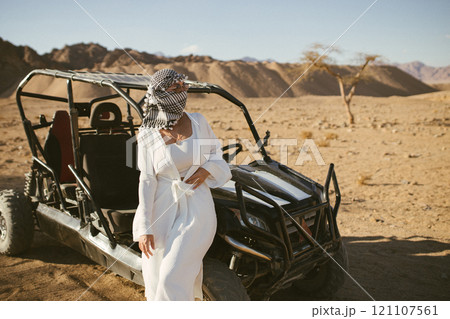 Woman tourist on quad bike ATV safari with desert background of Sharm El Sheikh Egypt 121107561
