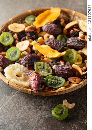 Dried tropical fruits with various nuts and raisins. Dried tropical fruits with various nuts and raisins. 121107622