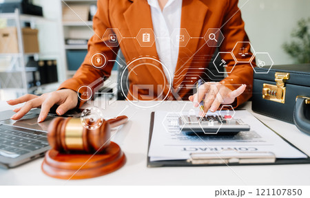 justice and law concept.businessman or lawyer or accountant working on accounts using a smart phone laptop digital tablet calculator justice and law concept.businessman or lawyer or accountant working on accounts using a smart phone laptop digital tablet calculator 121107850