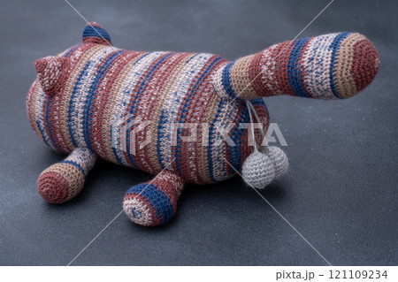 Crocheted toy cat. Melange thread. Hobby: knitting. Funny animal. Crocheted toy cat. Melange thread. Hobby: knitting. Funny animal. 121109234