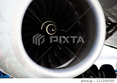 Airplane turbine. Motions blur. Engine blades propeller. Aaircraft jet engine. Close up. Aviation Technologies. Aircraft jet black detail during maintenance. Background. Airplane turbine. Motions blur. Engine blades propeller. Aaircraft jet engine. Close up. Aviation Technologies. Aircraft jet black detail during maintenance. Background. 121109269
