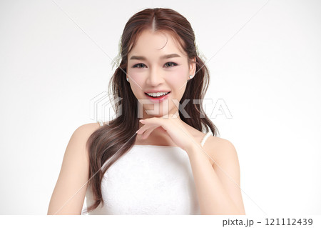 Beautiful young asian woman with clean fresh skin on white background, Face care, Facial treatment, Cosmetology, beauty and spa, Asian women portrait. Beautiful young asian woman with clean fresh skin on white background, Face care, Facial treatment, Cosmetology, beauty and spa, Asian women portrait. 121112439