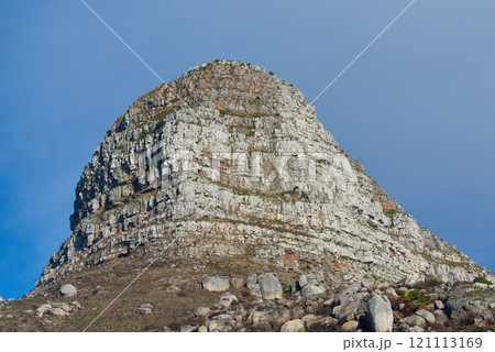 Copy space with scenic view of Lions Head mountain in Cape Town South Africa against a clear blue sky background from below. Beautiful panoramic of an iconic landmark and famous travel destination 121113169