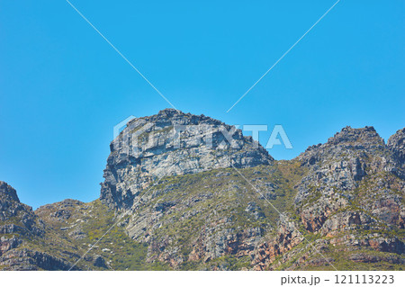 Scenic landscape of Twelve Apostles mountain under clear blue sky copy space in Cape Town, South Africa. Famous travel and tourism destination with steep hiking terrain and growing trees and bushes Scenic landscape of Twelve Apostles mountain under clear blue sky copy space in Cape Town, South Africa. Famous travel and tourism destination with steep hiking terrain and growing trees and bushes 121113223