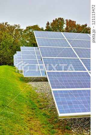 Solar power plant. A renewable energy source producing sustainable clean solar energy from the sun. Photovoltaic panels generating alternative energy from nature on an off the grid farm in Denmark Solar power plant. A renewable energy source producing sustainable clean solar energy from the sun. Photovoltaic panels generating alternative energy from nature on an off the grid farm in Denmark 121113472