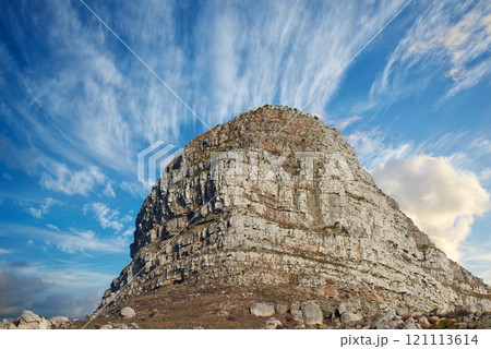Copyspace with scenic landscape view of Lions Head mountain in Cape Town South Africa against a cloudy blue sky background from below. Magnificent panoramic of a famous attraction and iconic landmark 121113614