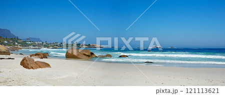 Copyspace landscape and seascape view of a tropical beach in summer. Idyliic seaside tourist attraction abroad. Summertime holiday resort at the seashore on vacation. Beautiful exotic island Copyspace landscape and seascape view of a tropical beach in summer. Idyliic seaside tourist attraction abroad. Summertime holiday resort at the seashore on vacation. Beautiful exotic island 121113621